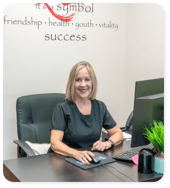 member of dental staff smiling